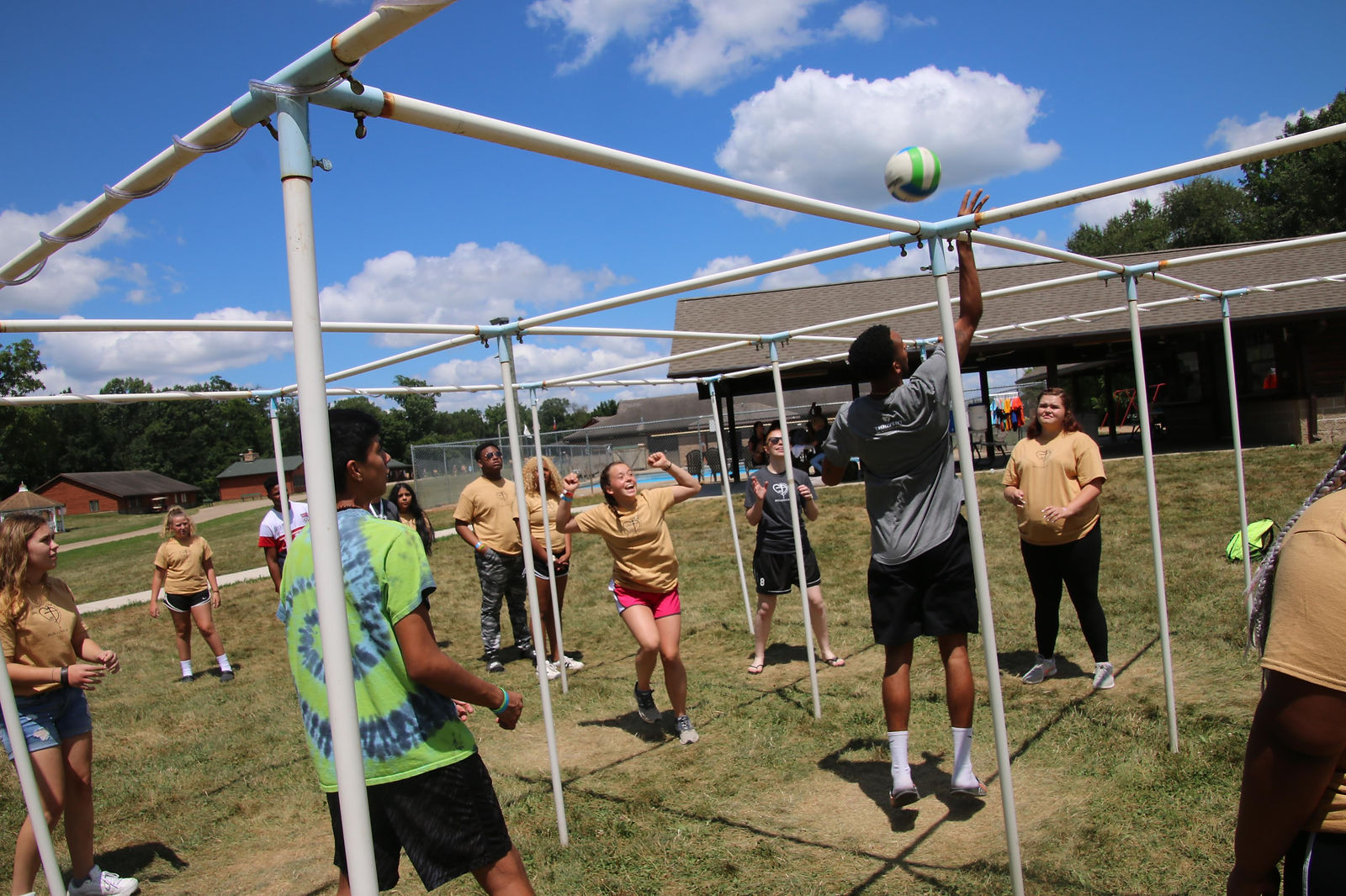 A mix of volleyball and 4-square...but with 9